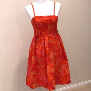 Smocked orange floral print smocked sundress. Size XS